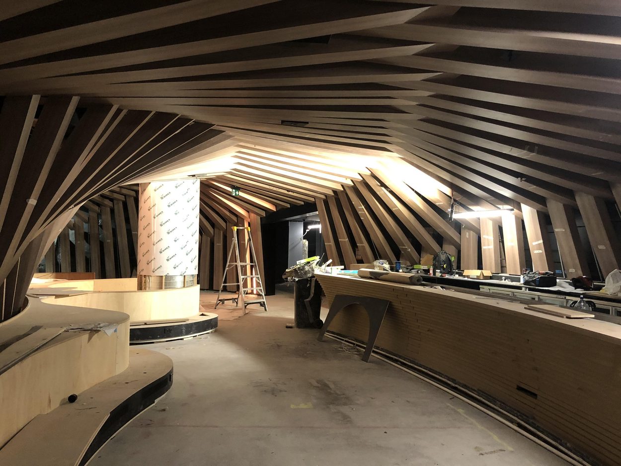 The same bar in construction, timber ribs installed over the bare counter carcass