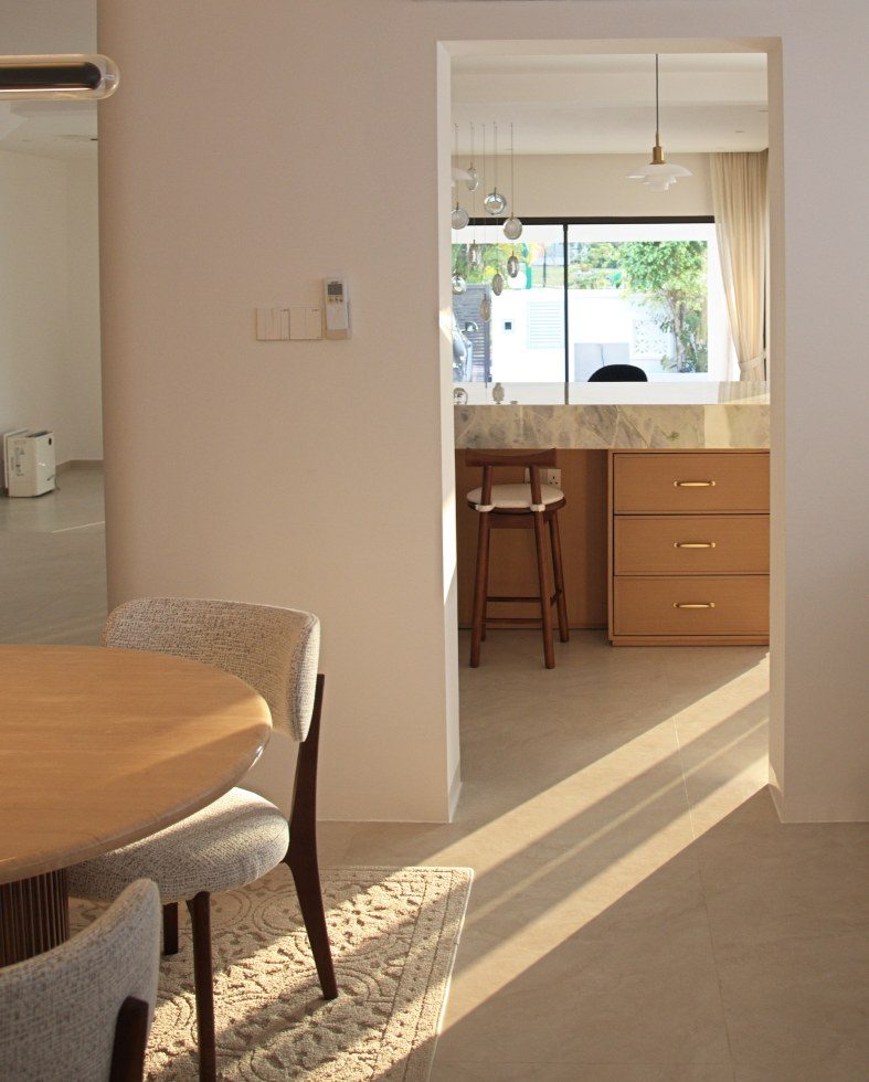 Afternoon sun laid across the floor through an opening to the dry kitchen
